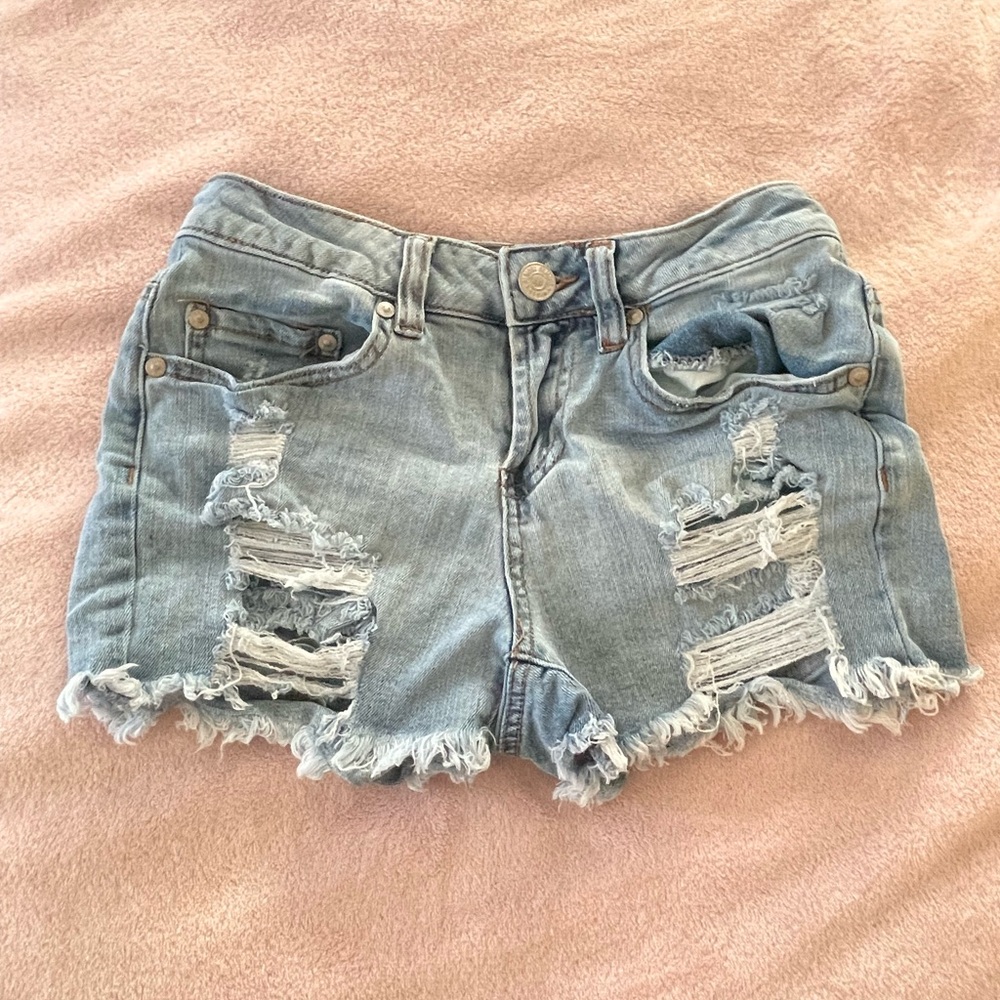 light blue denim ripped shorts, size 0